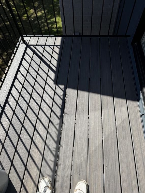 New railing and composite decking on a balcony