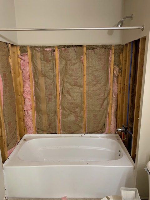 Bathroom wall opened to framing before a tub surround goes in