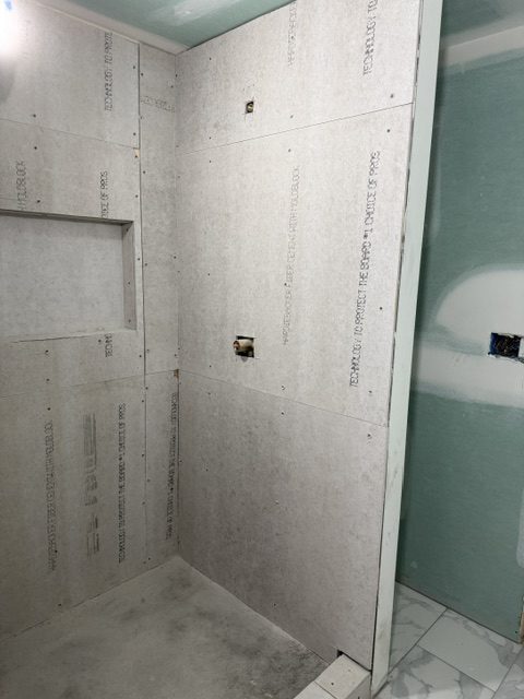 Cement board set in a shower before tile