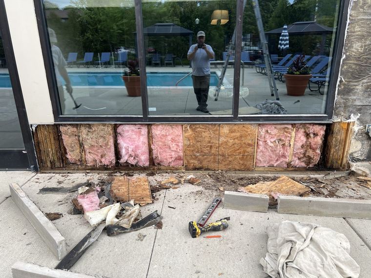 Wall framing and insulation exposed during clubhouse repair