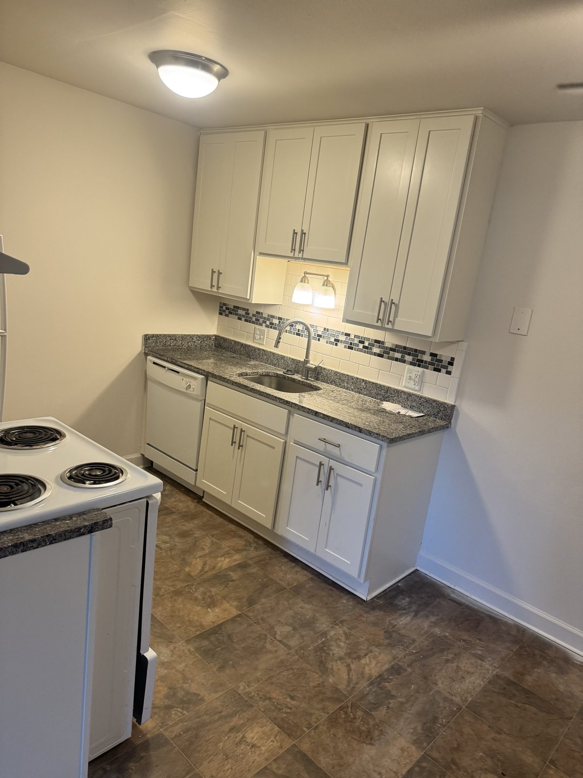 Finished apartment kitchen after a unit turn