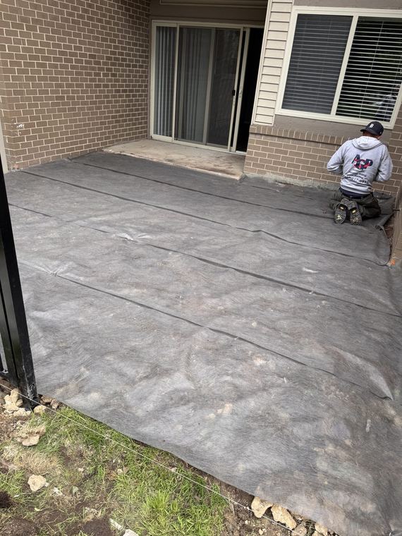 Concrete patio and walkway at a ground-floor unit