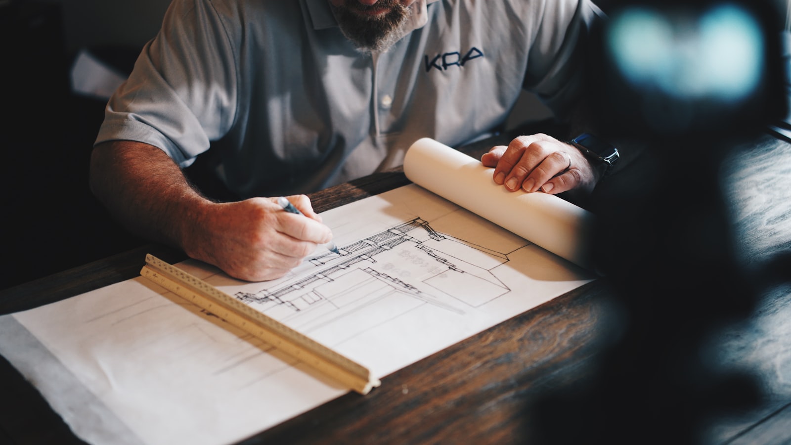 Drafting construction details at the drawing board