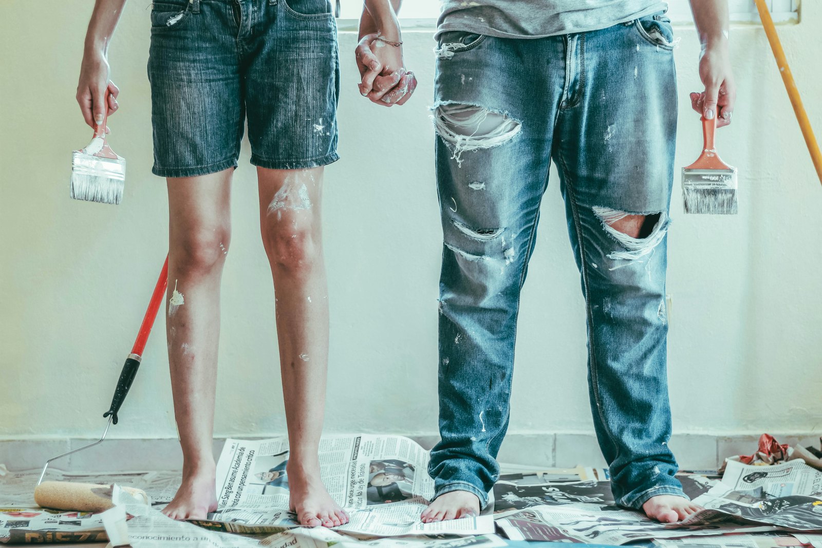 Painters with brushes and drop cloths