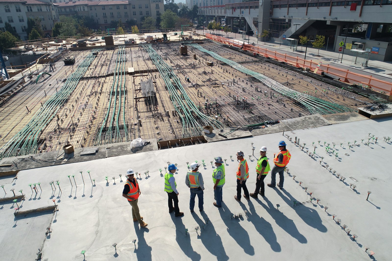 Construction crew walking a commercial site slab